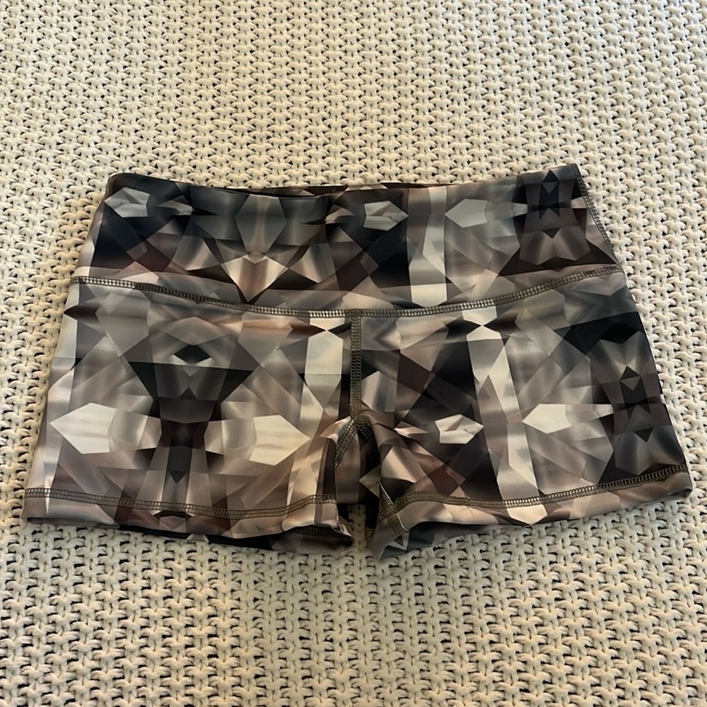 Size XS Bike Shorts. Hidden waistband pocket. White and grey in color.